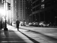 A woman walking on a busy city street.