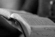 A women reading a Bible.
