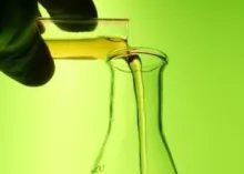 scientist filling beaker