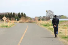A person walking on a road.