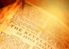 Bible opened to the book of Revelation.