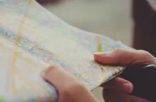 Hands holding a map.