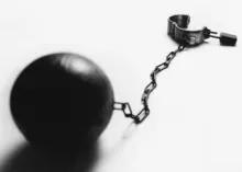 Ball and chain with hand cuff.
