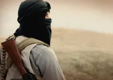 Muslim militant with rifle.