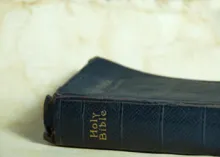 Bible laying on its back.