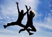 two people jumping in the air