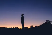 A man looking up at the stars.