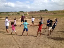 children holding hands playing games