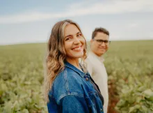 a woman and a man in a field