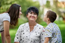 A mom with her daughter and son.