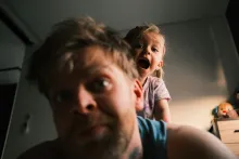 A father and daughter playing.