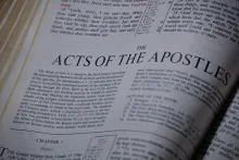 Bible opened to the book of Acts.