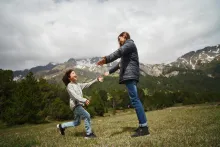 a child running to a woman with outstretched arms