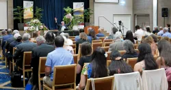 a group of people seated indoors for church services