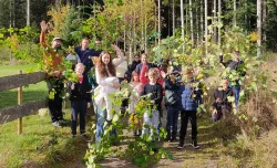 a group of people on a trail outdoors