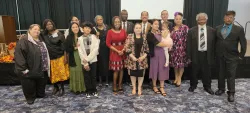 a group of people standing indoors