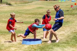 Camper diving for a ball
