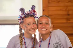 Two campers smiling