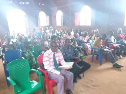 a group of people seated inside for church services