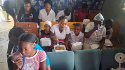 a group of people seated indoors