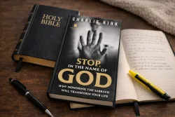 The book "Stop, in the Name of God" laying on a table with a Bible and notebook.