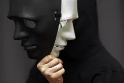 A mask with a black and white face.