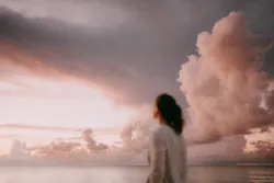 A woman looking up into the sky.