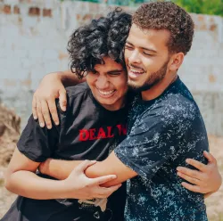 A two guys hugging.