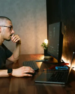 a man looking at a computer screen