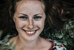 Upclose photo of a young woman face.