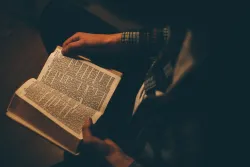 A man reading a Bible.