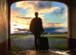 A man with a suitcase.