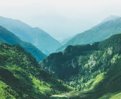 Photo of valley surrounded by mountains.