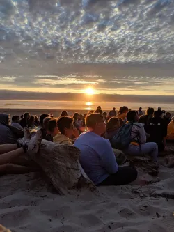 Sunset over a group of campers on the coast