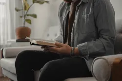 A person reading a Bible.