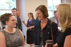 women talking at church services