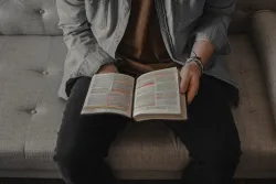 A man reading a Bible.