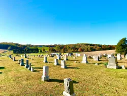 a cemetary filled with to,bstones
