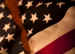 A torn United States flag.