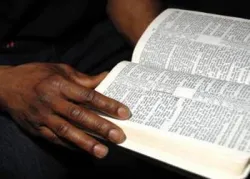 Black hand and Bible - Jesus Christ and the Sabbath