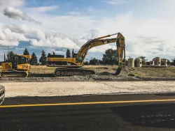 construction equipment working on a site and removing dirt