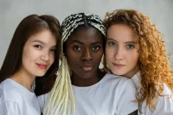 three women with differing skin tones