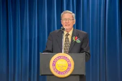 a man standing at a lectern