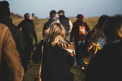 Group of people walking away from the camera
