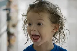 A young child singing.