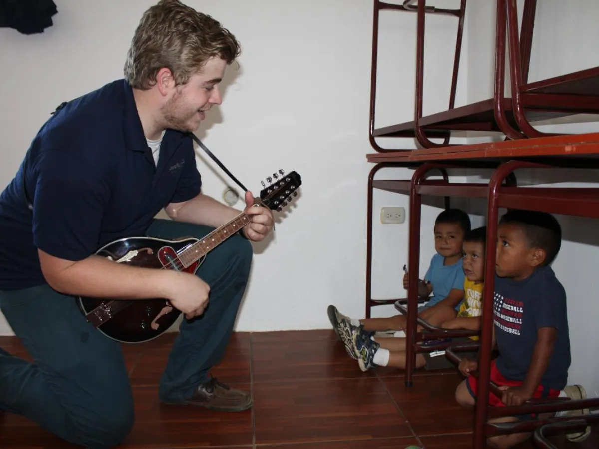 Garrett playing music for the Kids