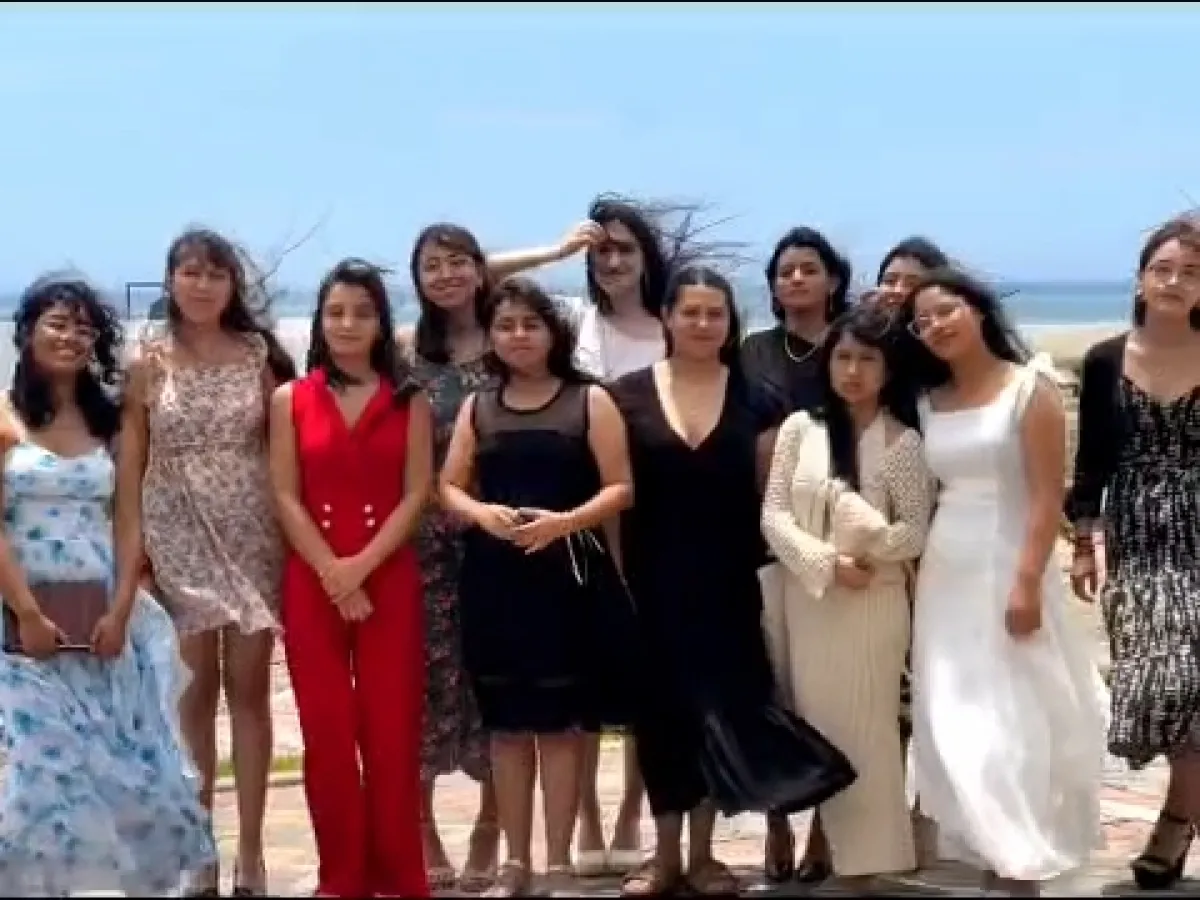 a group of teenage girls on the beach