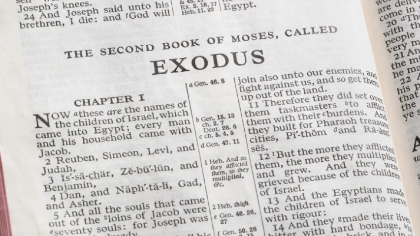 A Bible opened to the book of Exodus.