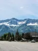 a road in a town with mountains in the background