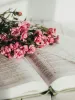 pink flowers on an open Bible